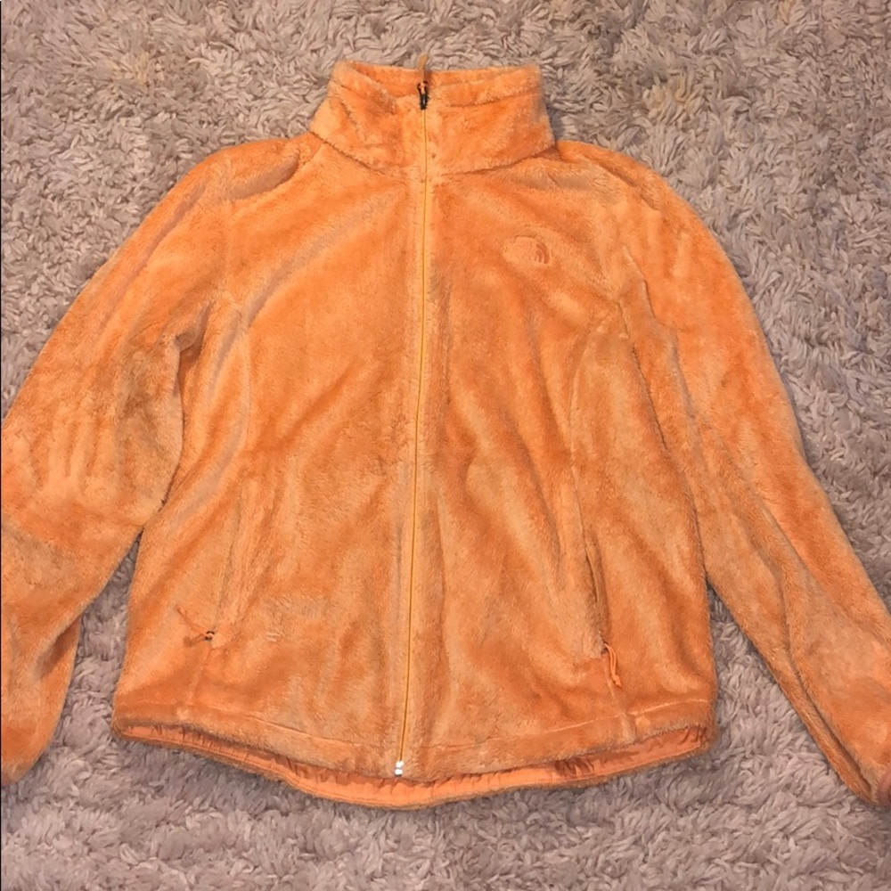 NORTH FACE highlighter orange jacket.
